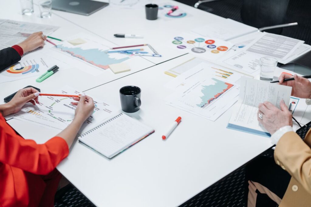 Team reviewing financial charts and reports together at a table