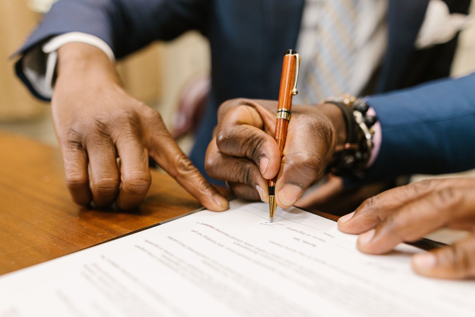 Business owner signing formation documents that appoint a registered agent