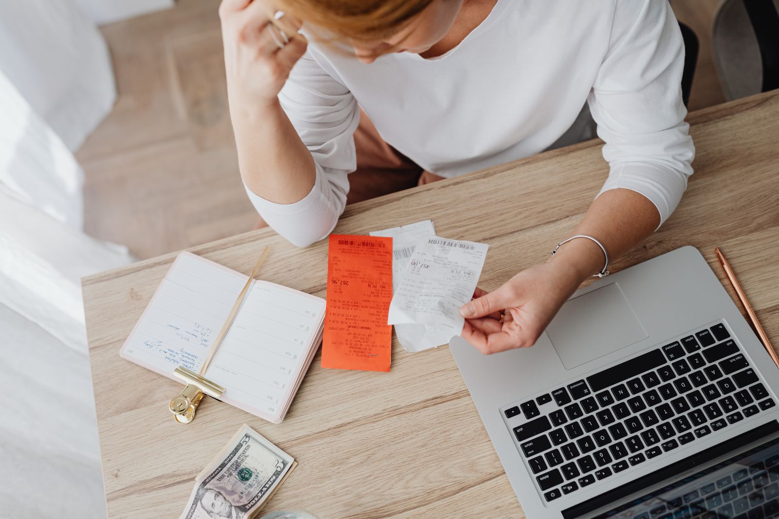 Business owner sorting receipts to separate business and personal finances