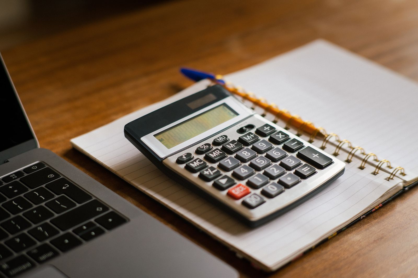 Calculator and notebook used to keep separate books for a small business